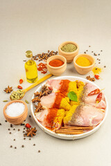 Chicken and curry spices. Set of raw ingredients for cooking traditional food