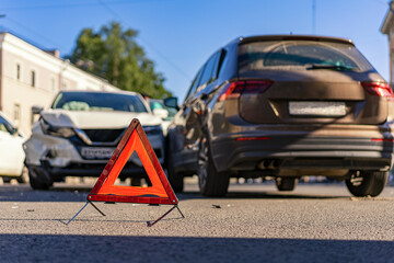 An accident on a city street. Non-compliance with driving rules, damage to property. Responsibility. Inattention of the driver.