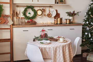 Christmas kitchen and table. Red, green and white decor christmas tree background. New Year celebration. Merry Christmas and Happy New Year.