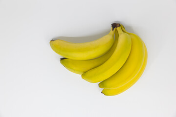 yellow green banana bunch on white background, ideal for cropping for photo compositions, studio shot, long exposure, iso 100