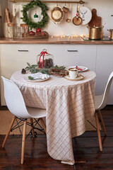 Christmas kitchen and table. Red, green and white decor christmas tree background. New Year celebration. Merry Christmas and Happy New Year.
