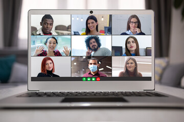 Fototapeta na wymiar Multiethnic college students distance learning virtual remote class, group online interactive lesson on video conference call talking with professor via computer