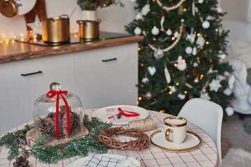 Christmas kitchen and table. Red, green and white decor christmas tree background. New Year celebration. Merry Christmas and Happy New Year.