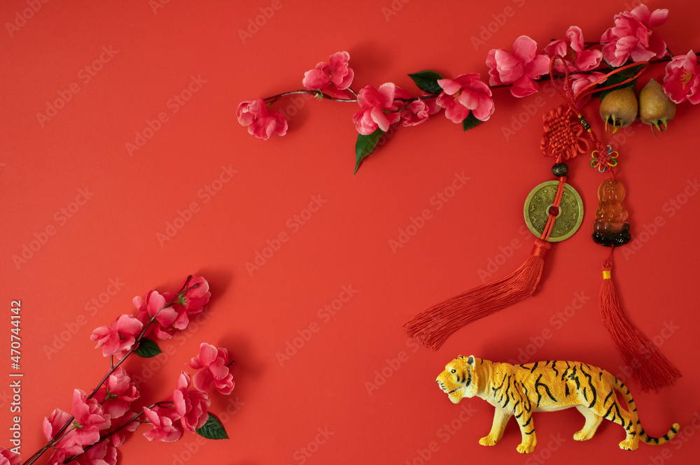 Wall mural Chinese New Year 2022 Spring Festival. Flat lay, Happy Lunar New Year of tiger.Traditional and modern concept red with cherry flower. Asian elements.