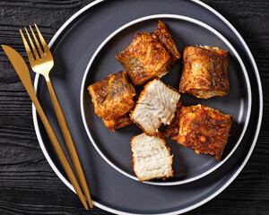fried pieces of hake on a plate