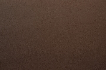 brown artificial leather with waves and folds on PVC base