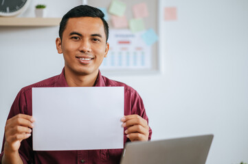 Male employee presenting work with documents
