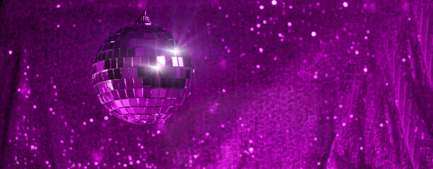 Disco ball on trendy background violet w sparkles and bokeh. Template holiday design, new year,...