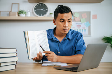 Fototapeta premium man working in office and holding documents