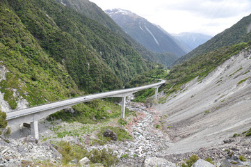 View of road in Arthur pass and high mountains, South island, New Zealand