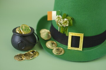 Saint Patrick background.Green leprechaun hat, flag,gold coins. Irish traditional spring...