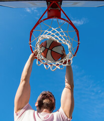 sport and hobby. dunk in basket. slam dunk in motion. summer activity. © Olena