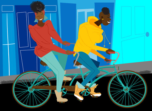 Lesbian couple riding a twin bicycle