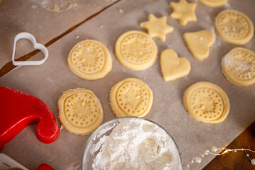 Merry Christmas and Happy Holiday. Christmas cookies close-up process cooking. Mom cooks with the children.