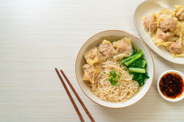 egg noodles with pork wonton soup or pork dumplings soup and vegetable