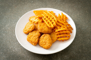 fried chicken nuggets with fried potatoes