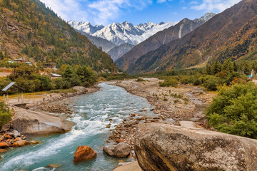 Baspa mountain river valley with scenic landscape and Himalaya  snow peaks at Rakchham Himachal Pradesh, India - obrazy, fototapety, plakaty