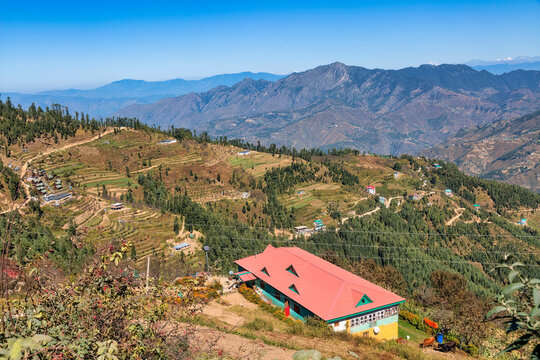 Scenic hill station at Himachal Pradesh, India with aerial view wof village houses on the mountain slopes with scenic Himalaya landscape at Sarahan