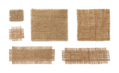 Set with pieces of natural burlap fabric on white background, top view