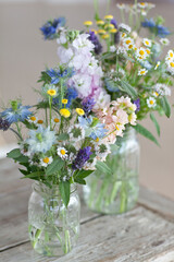 Wild Flower Bouquets In Mason Jars On Table