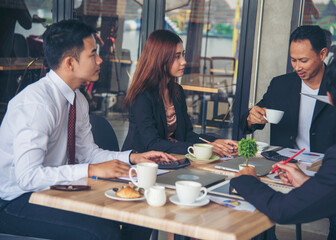 Group of business people meeting in conference room brainstorming consult business document graph chart office desk. Diversity multiethnic group of business people brainstorming and working together.