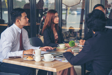 Group of business people meeting in conference room brainstorming consult business document graph chart office desk. Diversity multiethnic group of business people brainstorming and working together.