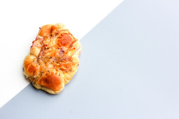 Bread is a staple food prepared from a dough of flour and water, usually by baking.