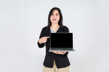 Beautiful Asian business executive woman pointing to laptop display screen to explain attractive office working info and addressing interesting offer