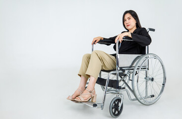 Obraz na płótnie Canvas Paralysis Asian woman suffers from accident injury, difficult to move forward by wheelchair transportation