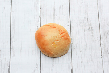 Bread is a staple food prepared from a dough of flour and water, usually by baking.