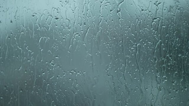 Droplets on window during rainy day