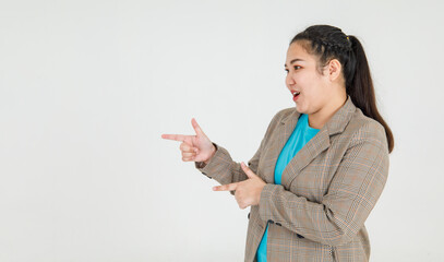 Lively Asian woman confidently pointing fingers to mark exactly correct direction and remarkable guide recommended to fire target