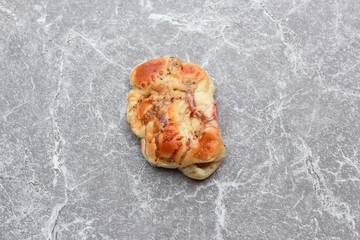 Bread is a staple food prepared from a dough of flour and water, usually by baking.