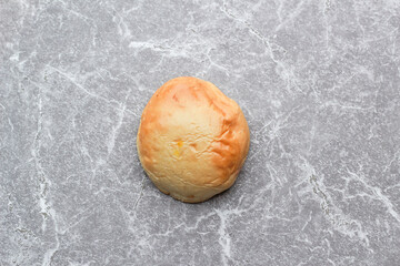 Bread is a staple food prepared from a dough of flour and water, usually by baking.