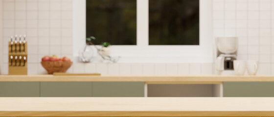 Empty space on wooden kitchen countertop on blurred kitchen space interior background