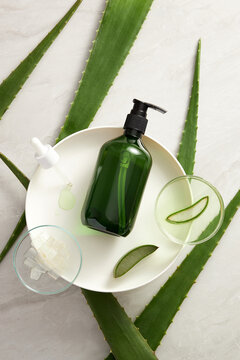 Aloe vera extract research in laboratory with a petri dish dropper and cosmetic jar template in white background for aloe vera research advertising , photography science content