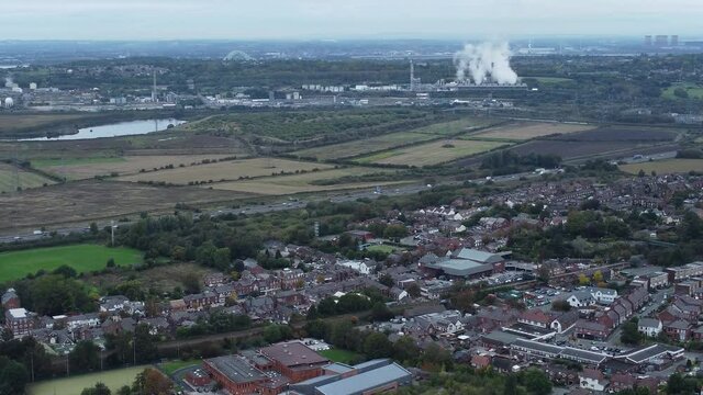 English industry urban landscape overlooking motorway and power station aerial rising view