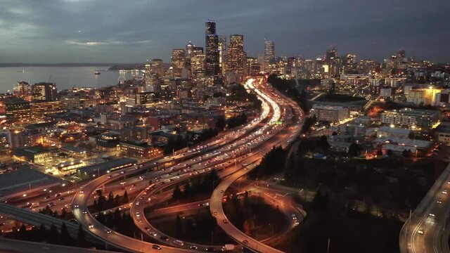 Cinematic 4K Aerial Drone Night Trucking Shot Of Downtown Seattle Central Business District, First Hill, Yesler Terrace, Atlantic, Freeway Interchange, Skyscrapers Viewed From North Beacon Hill