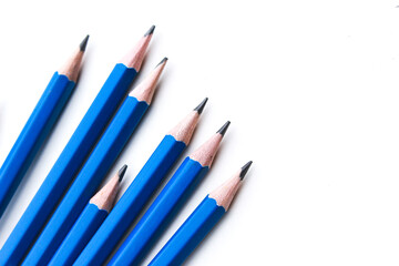 Blue pencil over white background. Stationery concepts.