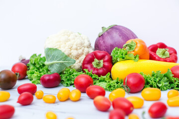 Fresh group of vegetables on white background.