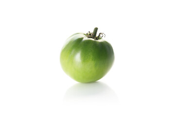 green tomato isolated on a white background
