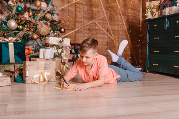 boy writes a letter to Santa Claus