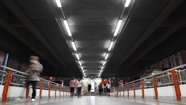 4K Commuters walking through skywalk on rush hour at Bangkok