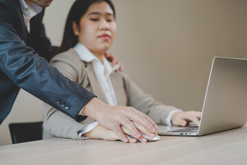 Unhappy, hand of asian young woman employee, man employer or colleague or boss touching her hand and embrace, feeling disgusted, uncomfortable. Sexual harassment inappropriate at workplace. - obrazy, fototapety, plakaty