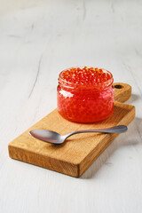 Open bowl with salmon red caviar