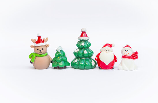 Cute Christmas decoration item on wite background, snowman with Santa and reindeer with Christmas tree isolate on white background, Christmas decoration item, festive season concept