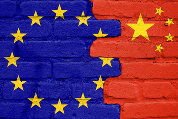 Europe Union and China flags painted on the brick wall