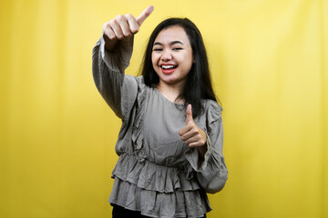 Beautiful young woman with thumbs up, ok sign, good job, victory, advertisement, isolated