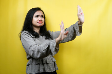 Beautiful young woman serious, with stop sign hand, prohibition sign hand, rejection, advertisement, isolated