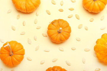 Natural pumpkin seeds and fresh vegetables on yellow background